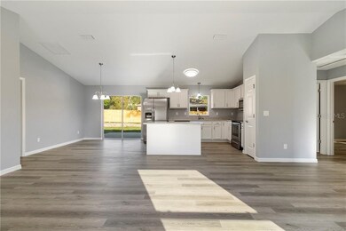 Open floorplan ~ spacious great room!  Vaulted ceilings.  Luxury vinyl plank flooring throughout.