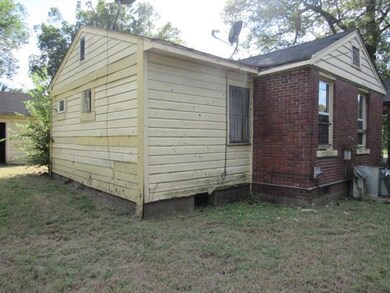 View of property exterior featuring a yard