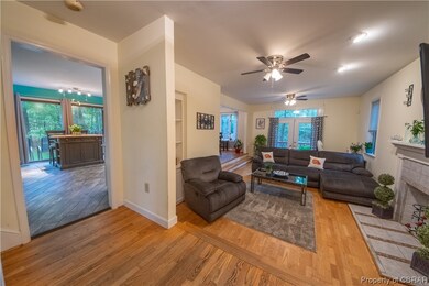 Looking towards kitchen, around to dining and open
