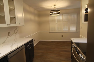 Kitchen featuring stainless steel appliances, ligh