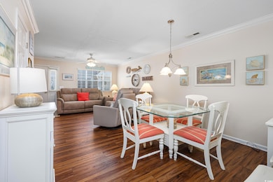 Dining area featuring baseboards, visible vents, d