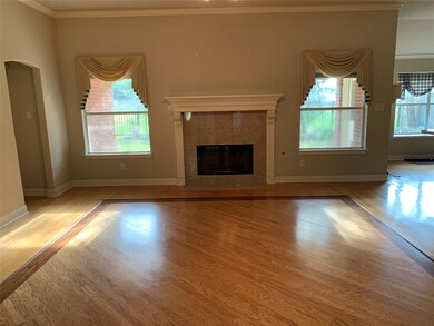  two large windows looking onto the back porch and yard. Separated by the Gas log fireplace.