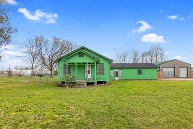 View of front & side yard with shop