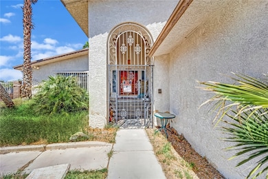 View of exterior entry featuring stucco siding and