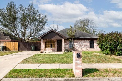 Ranch-style home with a front yard