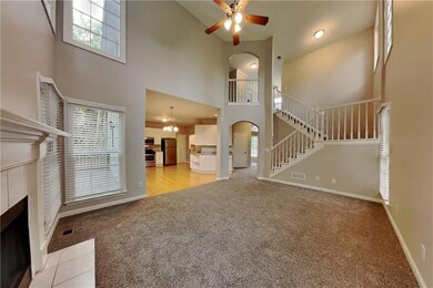Unfurnished living room with light colored carpet,