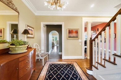 The gracious center hall entry greets you with a 10' ceiling trimmed with crown molding, an ornate historical chandelier and gleaming hardwood floors.