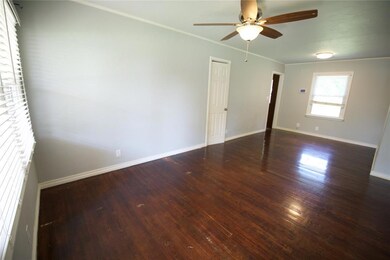 Spare room featuring ceiling fan, crown molding, a