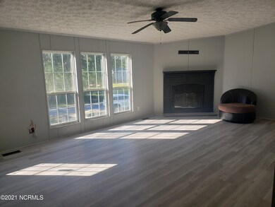 Living room has a fireplace.