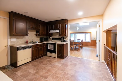 Kitchen prep and eat-in areas in one shot

 wood floors