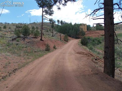Lot is to the left of the road.
