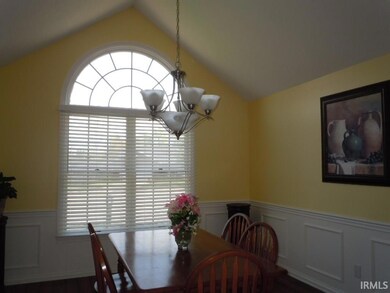 Vaulted ceiling, circle top window, chair rail and