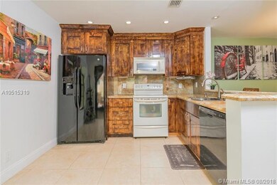 Updated kitchen with granite counter tops opens to