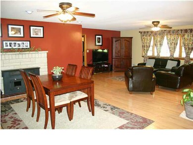 The dining area and the living area have maple har