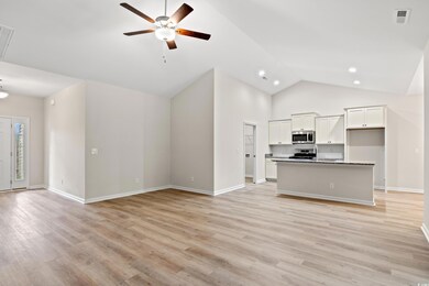 Unfurnished living room featuring high vaulted cei
