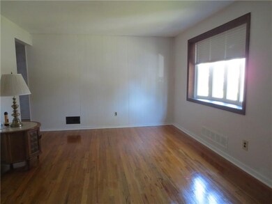 Sparkling hardwood floors and beautiful bow window