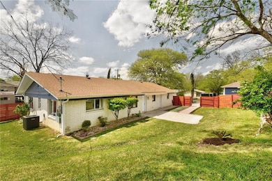 Rear view of house with central AC, a shingled ro