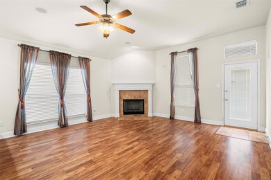 Open concept family room with wood floors througho