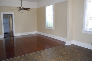 Open living and dining room! Restored hardwood flo