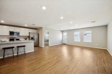 Dining is located just off the kitchen and family room