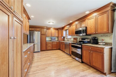 Kitchen was updated with hickory cabinets, granite