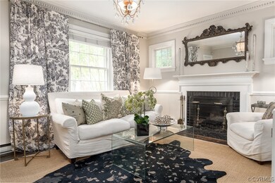 Living room with fireplace and dental molding