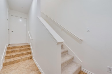 Stairway featuring tile patterned flooring