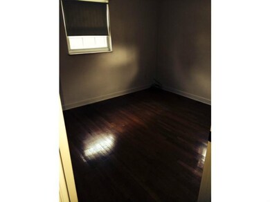 Exterior Front. Bedroom with Hardwood Floors