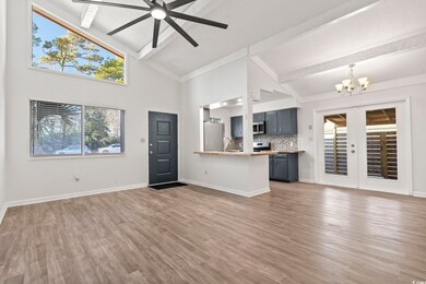 Unfurnished living room with dark hardwood / wood-