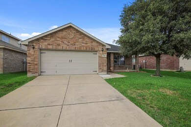A front flowerbed allows for easy to maintain landscaping year round.