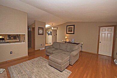 LIVING ROOM OPEN TO GALLEY KITCHEN AND DINING ROOM