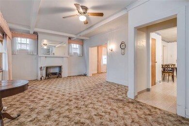 Huge Living Room with beamed high ceiling and deco
