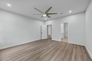 Unfurnished living room with ceiling fan and light