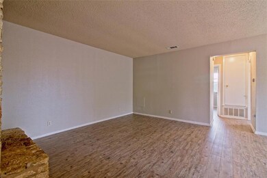 Unfurnished room featuring wood finished floors a