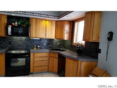 Kitchen. Solid-surface counters, stunning backspla