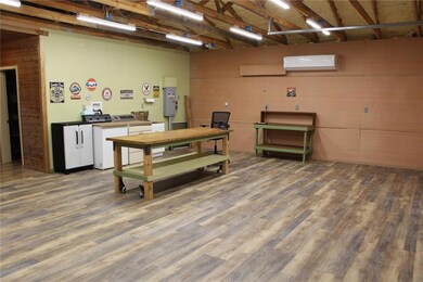 SHOP: Luxury vinyl flooring in shop side. Spray fo