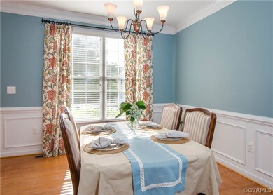 The formal dining room has hardwood flooring, doub
