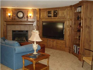 Family room in basement with a built in fireplace 