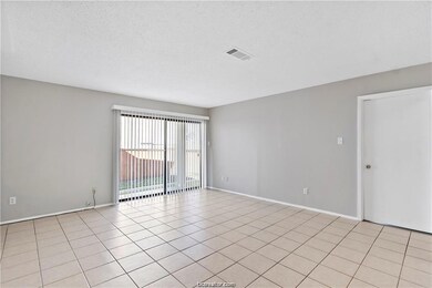 Unfurnished room featuring light tile patterned fl