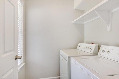 Washroom with washing machine and clothes dryer a