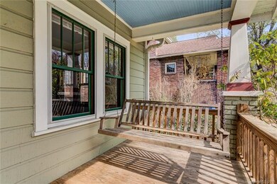 Huge front porch overlooking the quiet street and gardens..