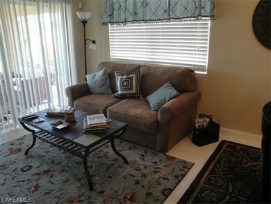 Den overlooking the screened lanai and great water