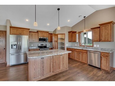 Kitchen with oak cabinets, granite counters, stain