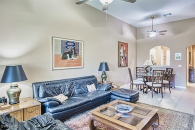 Living area featuring arched walkways, visible ven