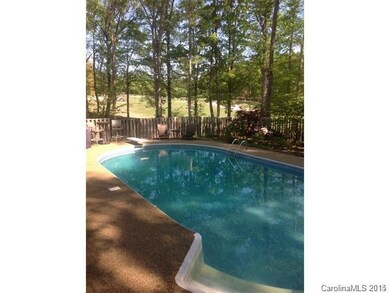 Beautiful rear fenced yard with in-ground pool ove