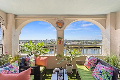 Balcony with an outdoor living space and a water view