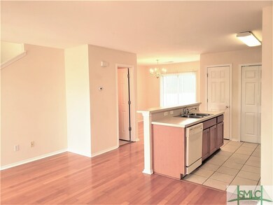 Open concept downstairs with half bath and laundry