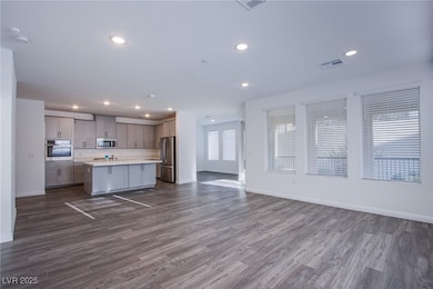 Kitchen with stainless steel appliances, open floo