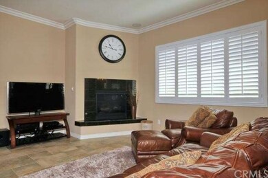 Marble fireplace & plantation shutters
