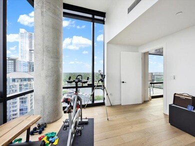 Exercise area featuring hardwood / wood-style flo